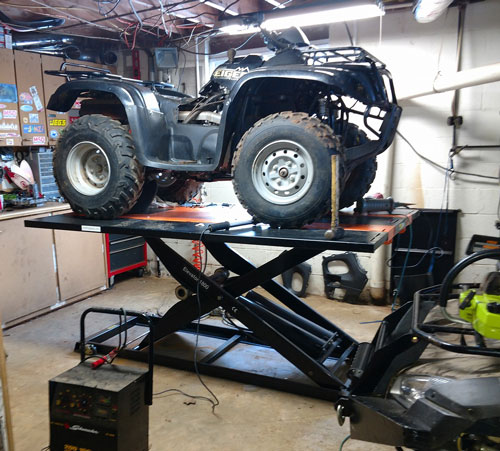 Suzuki Eiger 400 4x4 ATV atop Elevator 1800 ATV Lift Table