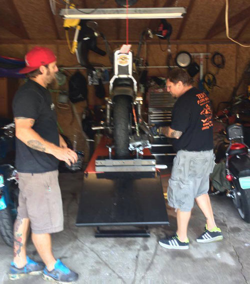 Chris Overton and Dan Deslauries, of Symphony Sycle, work on Harley using the PRO 1200 lift