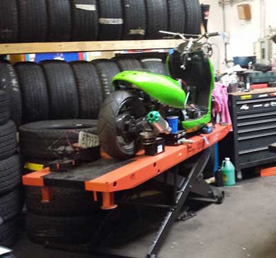 Tony's Auto and Cycle Repair in Lowell, MA uses pro 1200 to lift a 2004 Scooter Vento
