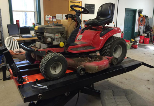 lawn tractor lifted by PRO 1200 motorcycle lift