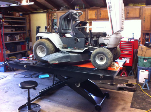 PRO 1200 motorcycle lift raises White lawn tractor for maintenance