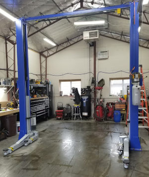 PRO 11000 2 post lift set up at repair shop