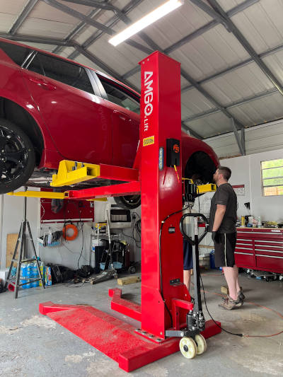 Mazda atop single post lift at Fusion5Motorsports